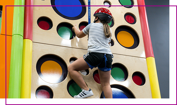 Kids on the COA Xtreme climbing wall
